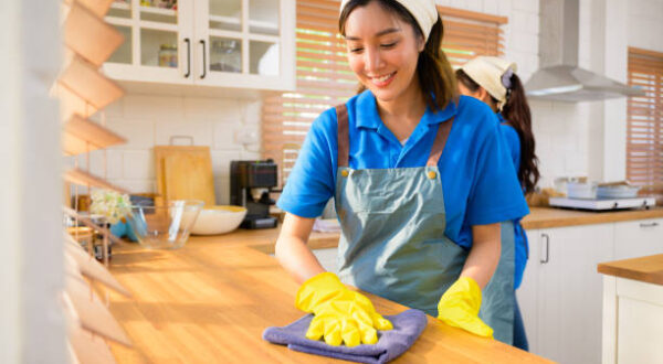 Couple of housekeeping staff cleaning house, Housekeeping and cleaning service, People doing housework at home. High quality photo